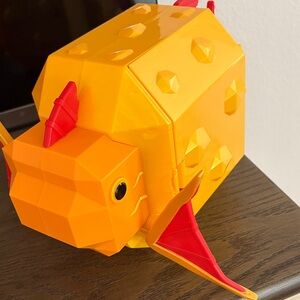 FISCH
Orange and Red Geometric Fish Toy
